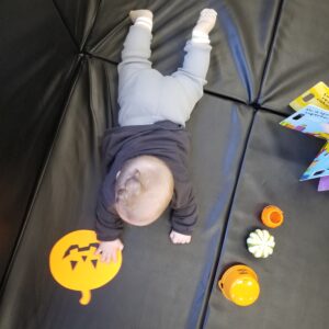 baby and pumpkins